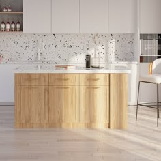 a modern kitchen with white cabinets and wood flooring