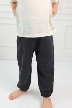 Introducing our comfortable and stylish Muslin Cotton Toddler Pants, perfect for both boys and girls. Made with high-quality muslin cotton and linen, these pants are soft, breathable, and gentle on your little one's skin. Our elastic waist design ensures a comfortable and secure fit, making it easy for your child to move around and play. These pants are perfect for active kids who love to run, jump, and explore. Available in a variety of colors and sizes, these pants are versatile and can be wor Solid Cotton Bottoms For Playwear, Casual Cotton Bottoms For Playwear, Casual Relaxed Fit Bottoms For Playwear, Spring Playwear Bottoms With Pockets, Playwear Bottoms With Elastic Waistband, Solid Cotton Playwear Bottoms, Cotton Bottoms With Elastic Waistband For Playwear, Casual Relaxed Fit Pants For Playwear, Toddler Khaki Pants