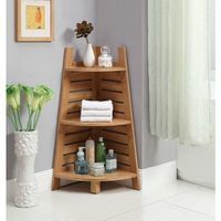 a wooden shelf with bottles and soaps on it next to a vase filled with flowers