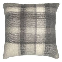 a gray and white plaid pillow on a white background