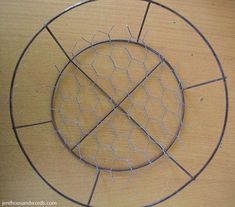 a metal wire circle on top of a wooden table