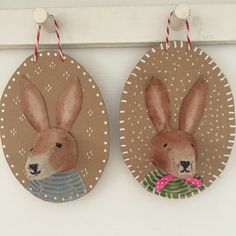 two easter decorations hanging on the wall