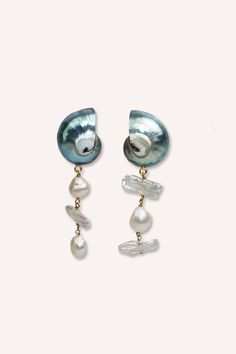 Introducing the Nautilus Shell and Freshwater Pearl Earrings, a beautiful mix of ocean charm and timeless style. These earrings feature nautilus shells, each showing off nature's spiral design and unique patterns. Paired with shiny freshwater pearls, they create a lovely balance of natural beauty and elegance. Handcrafted with care, each earring highlights the simple beauty of the Perfect for adding a touch of class to any outfit, these earrings celebrate the wonders of the sea. Enhance your jewelry collection with the Nautilus Shell and Freshwater Pearl Earrings, a stunning accessory for any occasion. Details: Shell Size: 1 x 1 inch Freshwater Pearls Earring Drop: 1.5 inch Hypoallergenic Nickle Free + Lead-Free Ocean-inspired Pearl Drop Earrings, Ocean-inspired Pearl Drop Earrings As A Gift, Elegant Pearl Charm Earrings With Shell, Ocean-inspired Shell-shaped Pearl Earrings, Elegant Teardrop Shell Jewelry, Ocean-inspired Dangle Pearl Drop Jewelry, Ocean-inspired Pearl Drop Dangle Jewelry, The Nautilus, Nautilus Shell