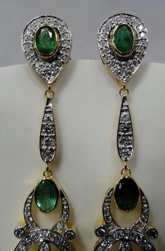 Art Deco 18 K solid gold Diamnds and Emerald dangle earrings. Beautiful one of type pair in very good condition. Length-7.5 cm, width-1.5 cm, the weight of pair-11.210 grams, material-18 K gold, Diamonds and emeralds. Diamond VS GH, approx 2.5 cats. Green Long Drop Earrings For Formal Occasions, Yellow Gold Pendant Earrings For Wedding, Formal Hand Set Round Danglers, Pendant Earrings For Formal Occasions, Formal Pendant Earrings, Formal Round Hand-set Danglers, Formal Round Danglers Hand Set, Hallmarked Diamond Drop Earrings, Yellow Gold Pendant Earrings For Formal Occasions