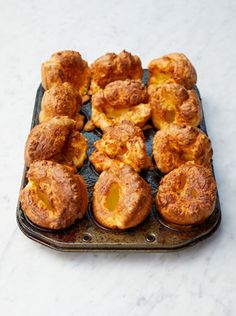 there are many muffins that are on the baking tray together and ready to be eaten