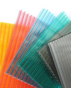 many different colored plastic sheets stacked on top of each other