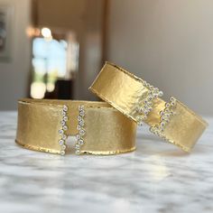 One (1) 14K yellow gold matte hammered diamond cuff bracelet prong set with (20) round brilliant cut diamonds 44/100CTW of fine (G-H) color and (VS2-SI1) clarity. 14.9g This bracelet can be customized or recreated to fit your needs. Please give us a call at 314-548-5100 to have your custom order placed. Timeless Wedding Cuff Bracelet With Single Cut Diamonds, Wedding Hammered Diamond Jewelry, Elegant Formal Hammered Cuff Bracelet, Luxury Hammered Bangle For Formal Occasions, Timeless Cuff Bracelet With Single Cut Diamonds For Anniversary, Timeless Anniversary Cuff Bracelet With Single Cut Diamonds, Elegant Hammered Cuff Bracelet, Elegant Formal Hammered Bangle, Fine Jewelry Diamond Cuff Bracelet In Gold