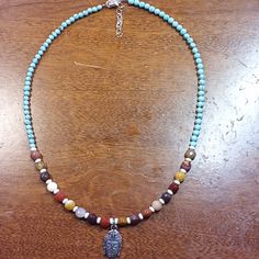 One Of A Kind, Adjustable, 17 Inch, Wegermite, All Natural Stone Necklace With Buddha Charm Blue Handmade Rustic Necklace, Rustic Handmade Blue Necklace, Rustic Blue Handmade Necklace, Rustic Multicolor Necklaces For Gifts, Rustic Multicolor Necklace For Gift, Blue Rustic Necklace For Gifts, Rustic Blue Necklace For Gifts, Rustic Blue Necklace For Gift, Tiny Necklace