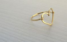 "Romantic heart gold-filled trendy boho ring for women and girls. This perfect ring can be used as a knuckle ring or a regular one, depending on the size you order. This charming heart ring that will fit both women and little girls. This can be a perfect gift for Bat Mitzvah or even sweet 16. Lovely as a friendship ring between mother and daughter. This ring is made from high quality 14K \"Gold Filled\" - unlike \"gold plating\" the gold in gold filled jewelry is mechanically bonded to the base Handmade Gold Heart Ring For Promise, Simple Gold Heart Ring For Valentine's Day, Elegant Handmade Heart-shaped Rings, Simple Open Heart Wedding Jewelry, Adjustable Heart-shaped Yellow Gold Midi Rings, Elegant Adjustable Heart-shaped Stackable Rings, Delicate Gold Stackable Rings For Valentine's Day, Adjustable Yellow Gold Heart Midi Rings, Adjustable Handmade Gold Heart Ring