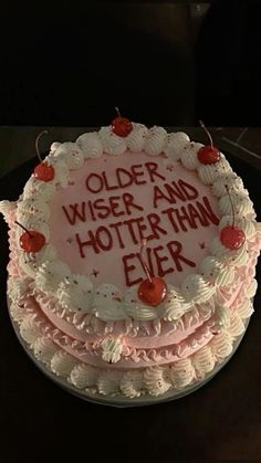 a birthday cake with the words older wise and hotter than ever written on it