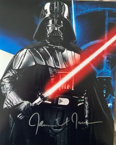 darth vader signed by the star wars fan in this photo is an autographed poster