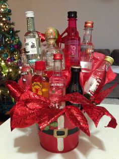 a christmas gift basket filled with liquor bottles