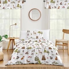 a bed room with a neatly made bed next to a window covered in animal curtains