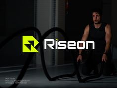 a man in black shirt standing next to a bike with the word riesen on it