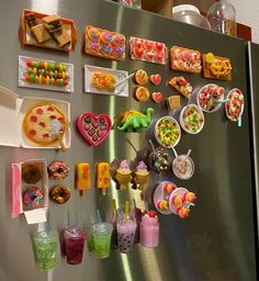 a refrigerator covered in lots of different types of food and drink on it's side