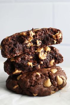 three chocolate cookies stacked on top of each other