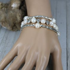 Classic and timeless, made with gorgeous real Freshwater Pearls and Tibetan Silver Patterned beads, this bracelet is the perfect choice for weddings, diner out to that nice restaurant, or anytime you want to feel special. The bracelet is elastic allowing for easy on and off and a fabulously comfortable fit. Designed to layer together each piece works together beautifully for a modern look with a classic style. Makes a great layering piece for that stacked bracelet look. Pearl is also one of June Adjustable White Pearl Bracelet For Mother Of The Bride, Pearl Beaded Stretch Bracelet For Wedding, Adjustable Beaded Rosary Bracelet For Wedding, Adjustable White Bracelets For Mother Of The Bride, Elegant Pearl Stretch Bracelet For Wedding, Wedding Pearl Rosary Bracelet With Round Beads, Elegant Pearl Rosary Bracelet For Wedding, Beaded Stretch Bracelet For Wedding, White Bangle Stretch Bracelet For Wedding