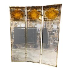 an old mirror with yellow flowers on it is in the shape of a room divider