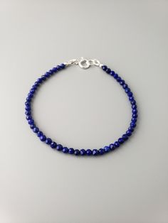 "This delicate bracelet is good to wear on its own or stack with other bracelets.  Round faceted undyed Lapis beads are 3mm. The length is 7\" by default, but leave me a note at the checkout if you need a different length.  All items are strung on the high quality stringing wire.  Lapis necklaces  https://www.etsy.com/shop/CrystalRise?ref=simple-shop-header-name&listing_id=1178749763&search_query=Lapis Link to the shop  https://www.etsy.com/shop/CrystalRise" Minimalist Crystal Bracelet With Faceted Beads For Everyday, Minimalist Everyday Crystal Bracelet With Faceted Beads, Dainty Faceted Beaded Bracelets, Minimalist Faceted Rondelle Beaded Bracelets, Everyday Adjustable Faceted Beaded Bracelets, Minimalist Faceted Beads Rondelle Bracelets, Minimalist Rondelle Bracelets With Faceted Beads, Minimalist Bracelets With Faceted Rondelle Beads, Everyday Single Strand Beaded Bracelets