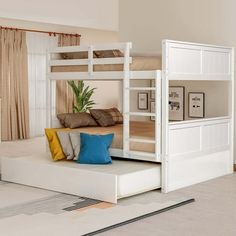 a white bunk bed sitting in the middle of a living room