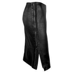 From the Fall/Winter 2001 collection, this black Gucci by Tom Ford skirt is constructed entirely of leather. Accented with a large zipper on one side, a design Ford later brought to his own label; this leather Gucci skirt is an elevated closet staple. Approximate measurements: Size - 40IT Waistband to hem: 22.5" Waist: 30 Hips: 36 - 38" 100% Leather Gucci Skirt, Tom Ford Leather, Bergdorf Goodman, Gianni Versace, Mood Board Fashion, Tom Ford, Pencil Skirt, Versace, Fashion Inspo Outfits