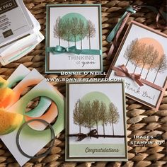 some cards are sitting on a basket next to some scissors and other crafting supplies