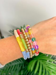 Elevate your summer style with our Shimmer Summer Stack Bracelet Set. This set of colorful bracelets is perfect for adding a fun and vibrant touch to any outfit. Expertly crafted with shimmering details, they are sure to make a statement. Make your summer shine with this must-have accessory. Multicolor Stackable Beaded Bracelets For Beach, Multicolor Stackable Stretch Bracelet For Beach, Multicolor Stackable Jewelry For The Beach, Trendy Stackable Summer Jewelry, Multicolor Stackable Beach Jewelry, Trendy Spring Bracelets For Party, Trendy Summer Stackable Jewelry, Trendy Everyday Bracelets For Spring, Trendy Stackable Beaded Bracelets For Beach