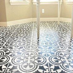 the floor is decorated with black and white tiles, which are patterned in an intricate pattern