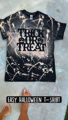 a person standing next to a t - shirt with the words trick or treat on it