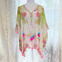 Johnny Was Galore Tassel Tie Silk Top Poncho In Floral Multi 100% Silk - Fabric Has A Little To No Stretch Colorful Flower & Leaf Print : White, Pink, Green, Yellow, Black V Neckline With Double String Tie Closure Blue & Pink Pom Pom Tassel Detail Embroidered Scalloped Edges Versatile: Can Be A Swimsuit Cover Up Or A Blouse! Excellent Condition One Size Fits All Aprox Measurements : 28” H X 42” W Out My Closet! Bundle & Save! New To Poshmark? Use My Closet Name Drewsula123 As The Referral Code When You Sign Up And Get 10% Off! Tags: Johnnywas Johny Jw Ivory Off-White Multicolor Multicolored Printed Pattern Design Motif Theme Vnec Multicolor Vacation Kaftan With Tassels, Multicolor Tasseled Kaftan For Vacation, Multicolor Tassel Kaftan For Vacation, Spring Multicolor Kaftan With Tassels, Multicolor Spring Kaftan With Back Tassel Tie-up, Spring Tassel Kaftan, Bohemian Blouse With Tassel Ties For Beach, Pink Bohemian Kaftan With Tassels, Spring Kaftan With Tassels And Kimono Sleeves