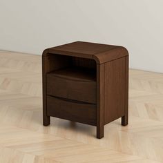 a small wooden table with two drawers on it