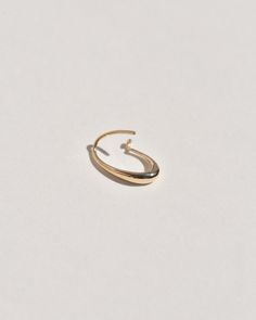 A semi-permanent style, the Sempre Hoop is part of a new offering of Leigh Miller that is designed to be worn everyday- or 'sempre'- which means always in Portuguese and Italian. This sculptural, solid gold hoop is intended to be put in, and never taken off. Wear it in the shower, in the pool or to sleep. Simply slide it in and fold the arm into its hook. Leigh was inspired to design this series to be the perfect huggers to compliment the rest of our sculptural earrings. The Sempre is ideal for Oval 14k Gold Hoop Earrings Timeless Style, 14k Gold Oval Hoop Earrings Timeless Style, Modern 14k Gold Oval Hoop Earrings, Modern Oval 14k Gold Hoop Earrings, Timeless Oval 14k Gold Hoop Earrings, Timeless 14k Gold Oval Hoop Earrings, Minimalist 14k Gold Oval Link Earrings, Minimalist Oval Halo Jewelry, Minimalist 14k Gold Oval Earrings