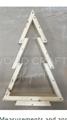 a wooden triangle with measurements and angles