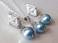 Wedding Light Blue Blush Baby Blue Colored Pearl Silver Earrings and Necklace Bridal Jewelry Set with .925 Sterling Silver Chain. CHAIN is 18 inches (45.7cm) long. EARRINGS are about 1.18 inch (3cm) long from top of earring stud to bottom. PENDANT is about 0.90 inch (2.3cm) long including bail. BRIDAL BRACELET SECTION: https://www.etsy.com/shop/LanaChayka?ref=seller-platform-mcnav§ion_id=11638942 BRIDAL EARRINGS SECTION: https://www.etsy.com/shop/LanaChayka?ref=seller-platform-mcnav§ion_id=11638 Blue Teardrop Jewelry For Wedding, Blue Wedding Jewelry With Matching Earrings, Blue Teardrop Wedding Jewelry, Blue Round Bridal Earrings For Formal Occasions, Light Blue Sterling Silver Earrings For Wedding, Light Blue Sterling Silver Wedding Earrings, Blue Pearl Drop Jewelry For Wedding, Blue Round Jewelry Sets For Wedding, Blue Pearl Drop Jewelry For Gift