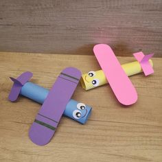 an airplane and a plane made out of construction paper