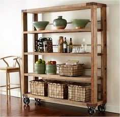 a wooden shelf with baskets and bottles on it