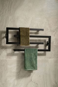 a towel rack with two towels hanging on it