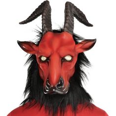 Release the beast from the burning hellfire in this devilish mask. The red latex mask features a goat head with skewed brown horns blank white eyes pointy red ears and a long black beard. Hellfire Beast Mask product details:  Latex mask  Mesh eyes Attached faux fur Secures by elastic band   One size fits most teens and adults Beast Mask, Goat Mask, Black Beard, Mens Hairstyles With Beard, Goat Head, Red Mask, Black Beards, Halloween Costume Shop, A Goat