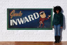 a woman standing in front of a sign that says good luck innward on it