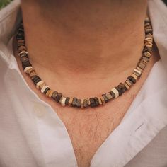 Our Men's Beaded Necklace is a perfect blend of rugged charm and modern style. Featuring an array of carefully selected beads, each with its own unique texture and color, this necklace is designed to make a statement. The beads are strung on a durable cord, ensuring longevity while maintaining a lightweight feel. Ideal for layering or wearing solo, this versatile accessory adds a touch of effortless cool to any outfit, whether you're dressing up for an event or keeping it casual. It's the perfect piece for men who appreciate bold, yet understated fashion. Understated Fashion, Men Necklace, Pendant Necklaces, Beauty Book, Modern Style, Jewelry Necklace Pendant, Layering, Accessory Gift, Beaded Necklace