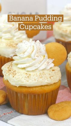 some cupcakes with white frosting and cookies