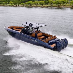 a blue and brown speed boat in the water