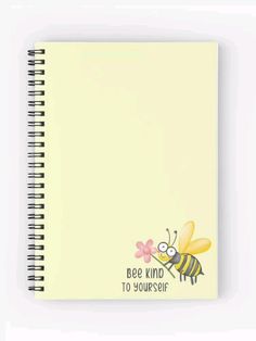 a spiral notebook with a bee and flower on the front, in light yellow paper