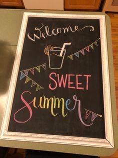 a chalkboard sign that says welcome to sweet summer