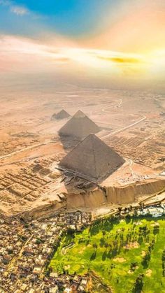 an aerial view of the great pyramids in giza, egypt during sunset or sunrise