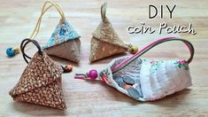 three small purses sitting on top of a wooden table with the words diy coin pouch