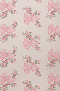 pink and green floral wallpaper with large bows on white background, closeup view