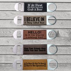 four bottle openers with different sayings on them