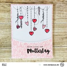 a card with hearts hanging from it