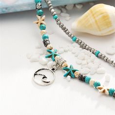 Whether you're walking the shore or just looking for sea-inspired shine, this layered anklet boasts starfish charms and reconstituted turquoise beads to bring beachy vibes to your everyday strides. 0.75'' W x 9.44'' L with 2.36'' extender Lobster claw clasp Silvertone copper / reconstituted turquoise Starfish Charm Anklets For Beach Vacation, Vacation Anklets With Starfish Charm For Beach Season, Vacation Beach Season Anklets With Starfish Charm, Blue Anklet With Starfish Charm For Vacation, Blue Starfish Charm Anklet For Vacation, Beach Season Strand Anklet With Starfish Charm, Turquoise Anklets With Starfish Charm For Beach, Turquoise Beaded Anklets For Beach Season, Turquoise Beach Anklets With Starfish Charm